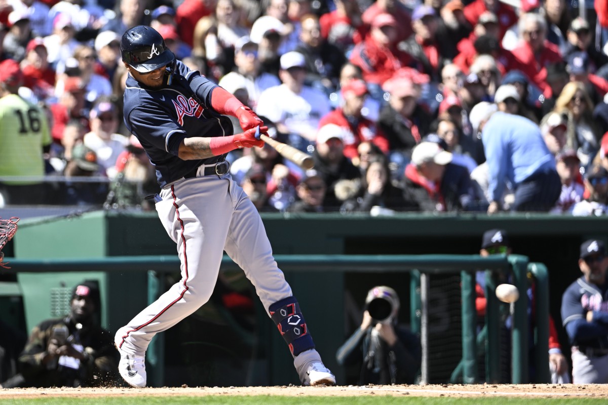 Mar 30, 2023; Washington, District of Columbia, USA; Atlanta Braves second baseman Orlando Arcia (11) hits an RBI single against the Washington Nationals during the second inning at Nationals Park. Mandatory Credit: Brad Mills-USA TODAY Sports